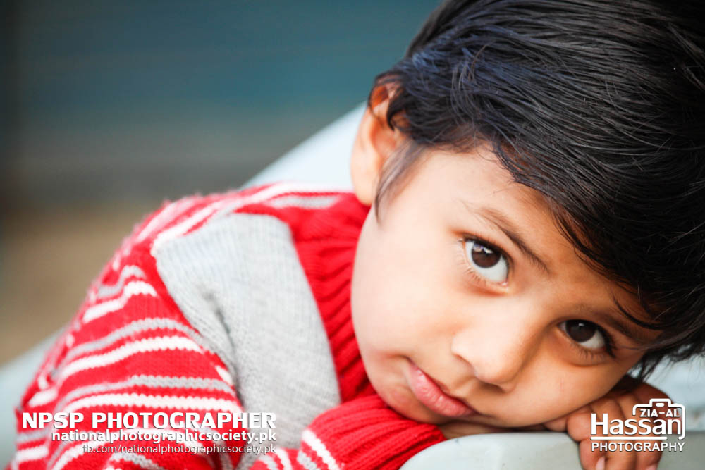 Innocent Child In Red Sweater On Road Side In Pir Mahal