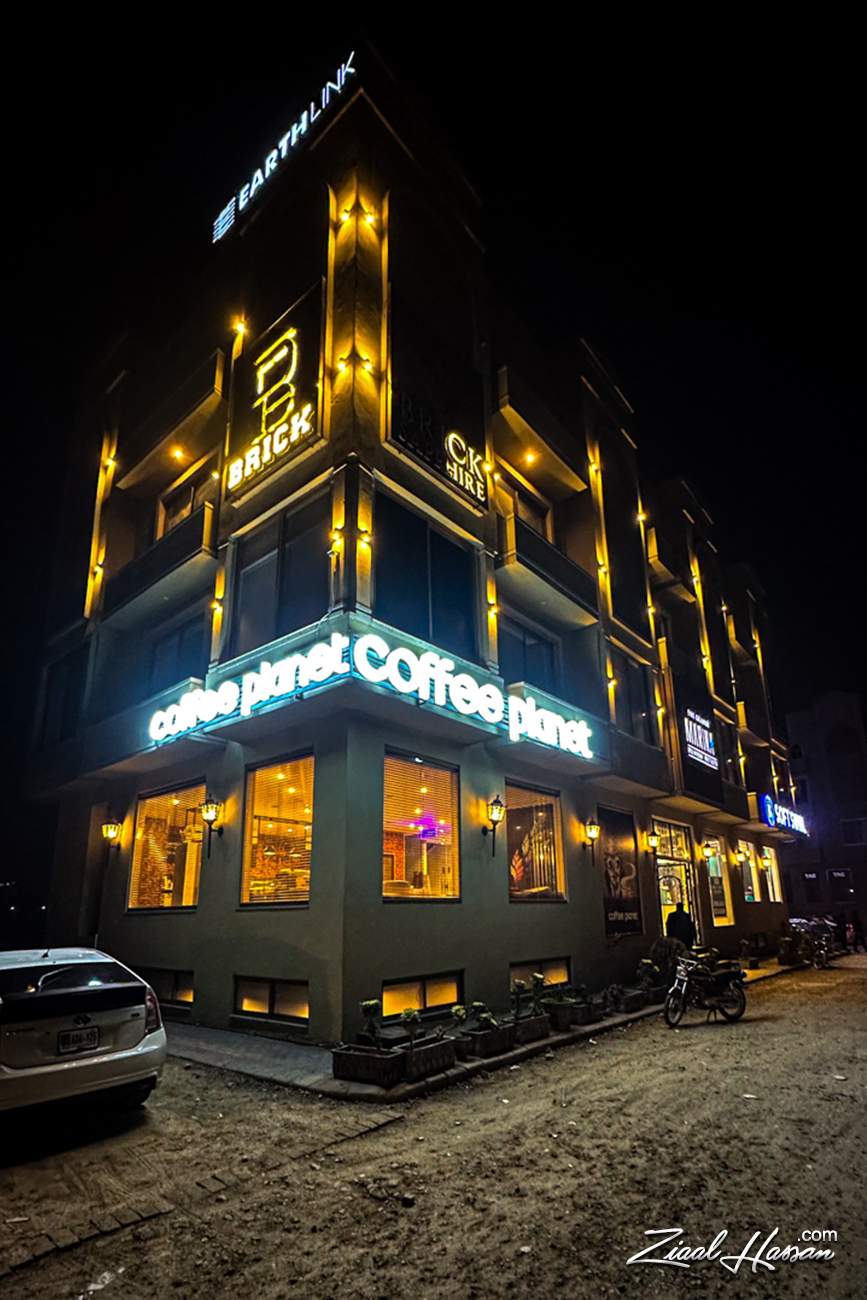Modern Coffee Planet Building with Warm Night Lighting - Dr. Zia-al-Hassan Photography