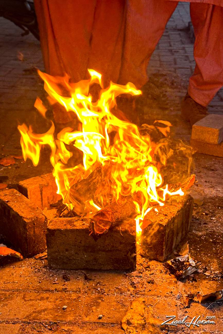 Traditional Brick Fire Pit with Bright Glowing Flames - Dr. Zia-al-Hassan Photography