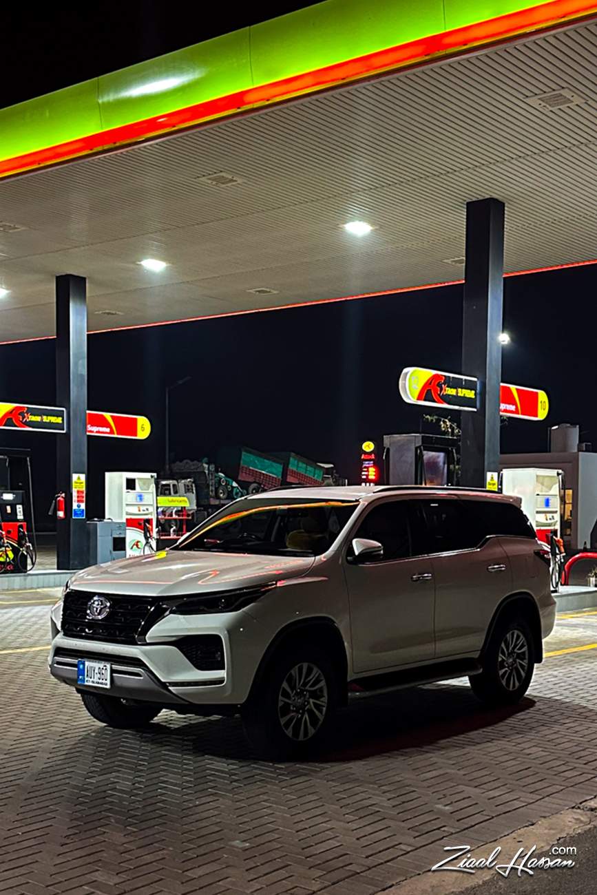 White Toyota Fortuner at a Modern Night Gas Station - Dr. Zia-al-Hassan Photography
