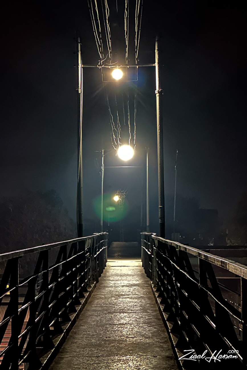 Atmospheric Pedestrian Bridge at Night with Industrial Lighting - Dr. Zia-al-Hassan Photography