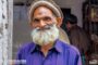 Happy Poor Old Man Standing By The Roadside In Murree