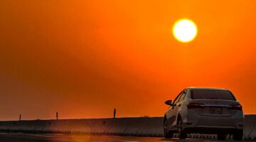 Golden Hour Sunset Over Highway with Driving Car - Dr. Zia-al-Hassan Photography