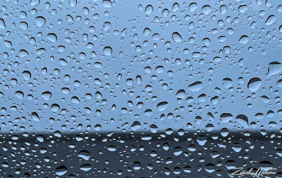 Soothing Raindrops on Glass with Moody Blue Tones - Dr. Zia-al-Hassan Photography