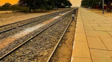 Golden Sunset Over Rural Railway Tracks at a Local Station - Dr. Zia-al-Hassan Photography