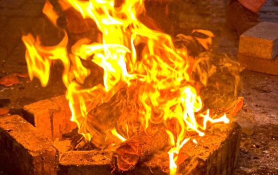 Traditional Brick Fire Pit with Bright Glowing Flames - Dr. Zia-al-Hassan Photography